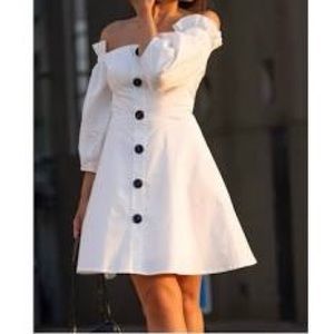 White dress off the shoulders.